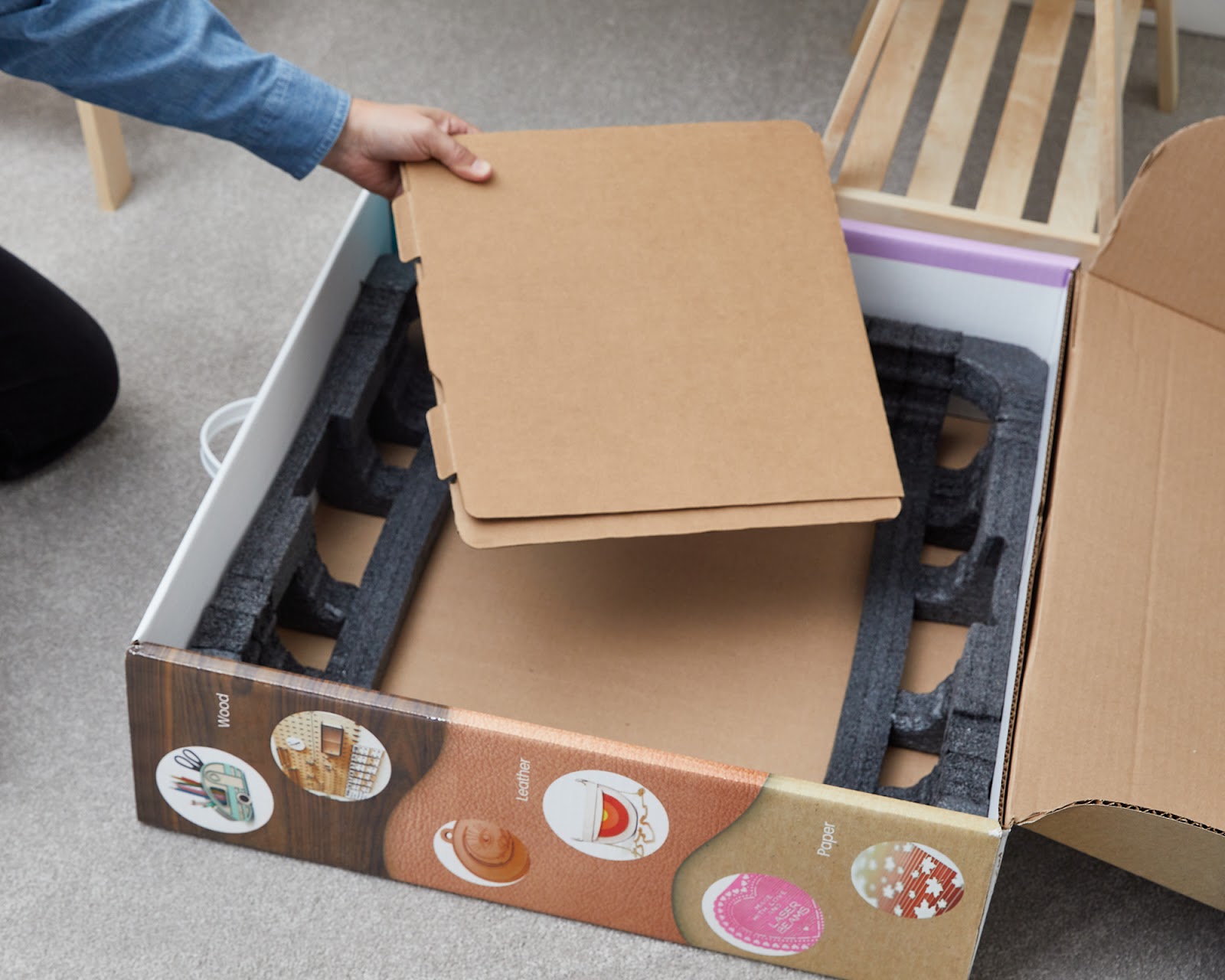 Photo of the cardboard sleeve, either in the box or being removed.jpg