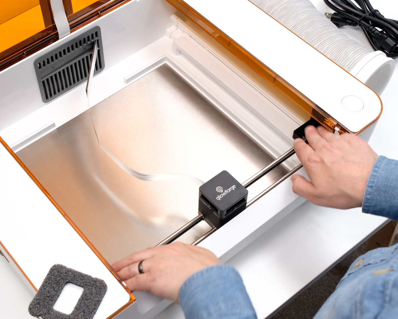 Action shot; holding the end caps, with the laser arm pulled to the back of the side rails.jpg