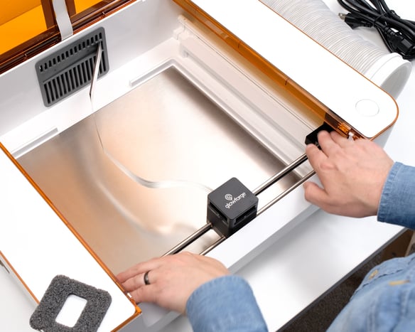 Action shot; holding the end caps, with the laser arm pulled to the back of the side rails.jpg
