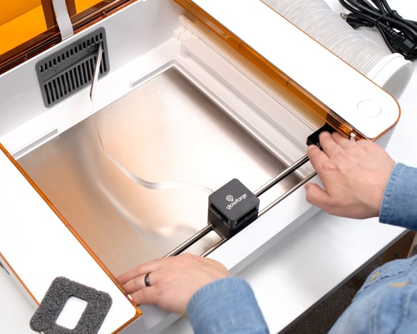 Action shot; holding the end caps, with the laser arm pulled to the back of the side rails.jpg
