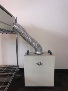 The path the Glowforge printer's exhaust hose follows