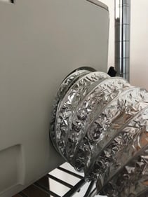 The are where the exhaust hose connects to the back of a Glowforge