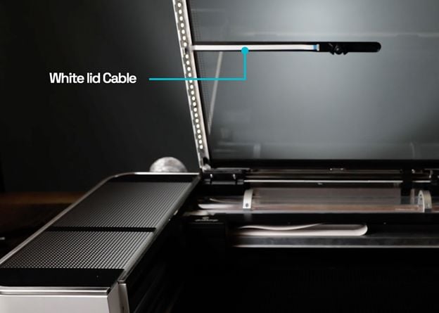 A Glowforge with its lid open and the lid camera visable