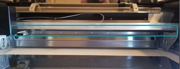 The Glowforge laser arm, viewed from the front.