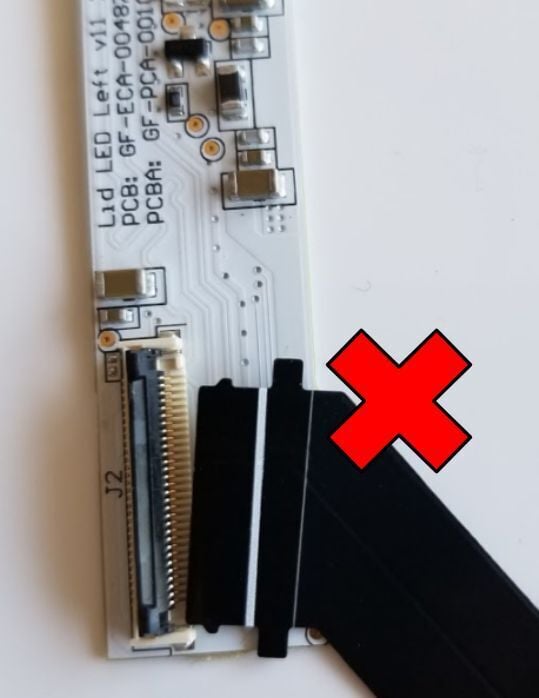 An example of bad cable alignment, the end of the cable is not parallel to the edge of the socket