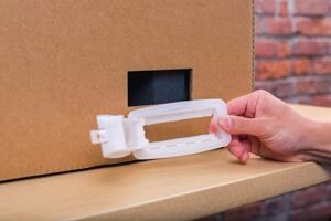 One hand holding a handle lock by its frame