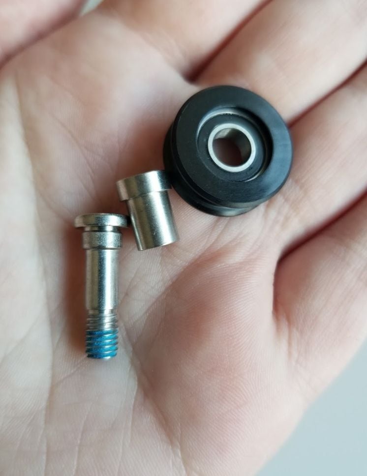 A front carriage plate wheel and the hardware that connects it to the plate