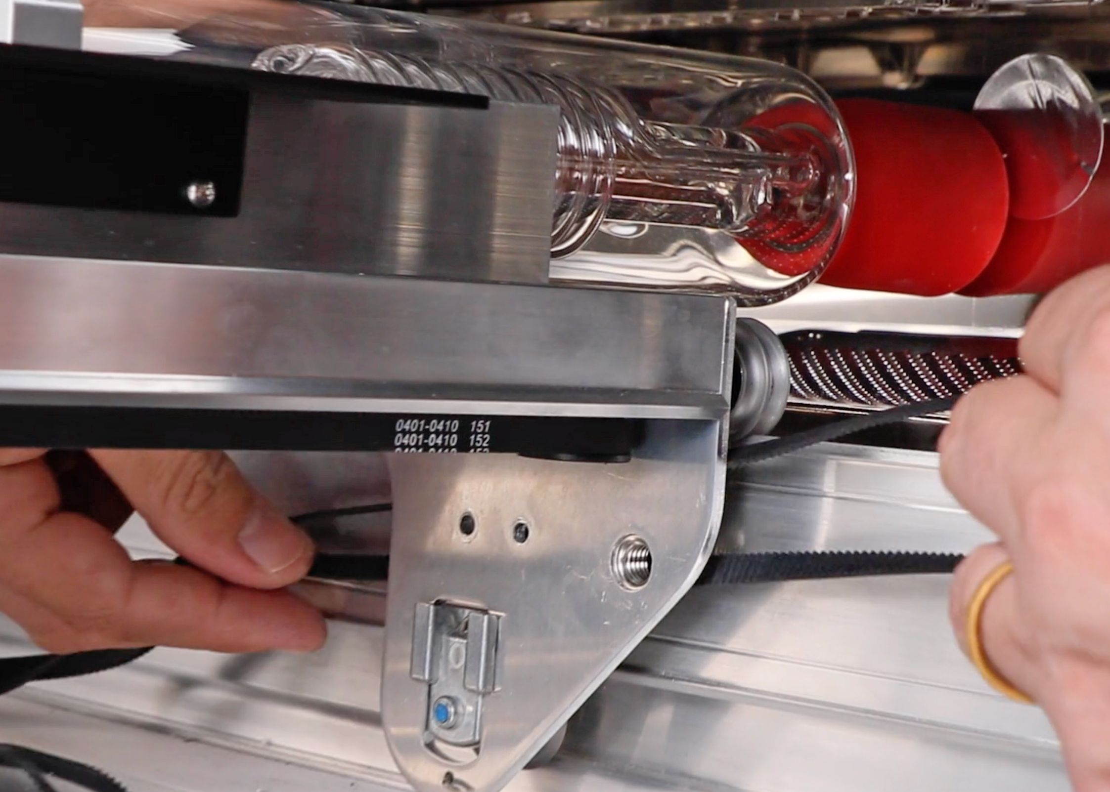 The belt slid in behind the side of the laser arm