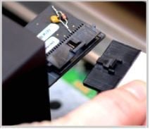 Unplugging the cable from the Glowforge print head