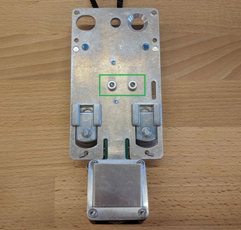 The underside of the carriage plate
