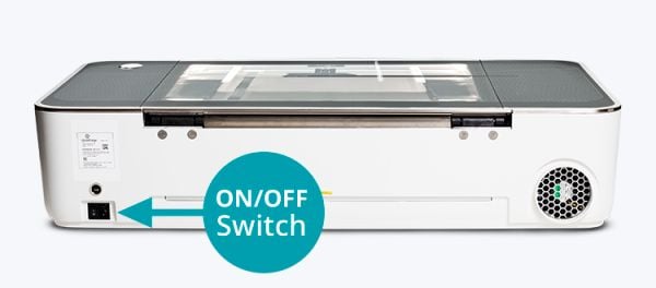 Back view of a Glowforge with the power switch in the bottom left highlighted