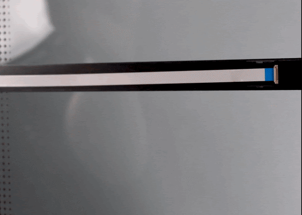 Animated gif of using a fingernail to open the cable clip and then carefully remove the end of the cable from its socket